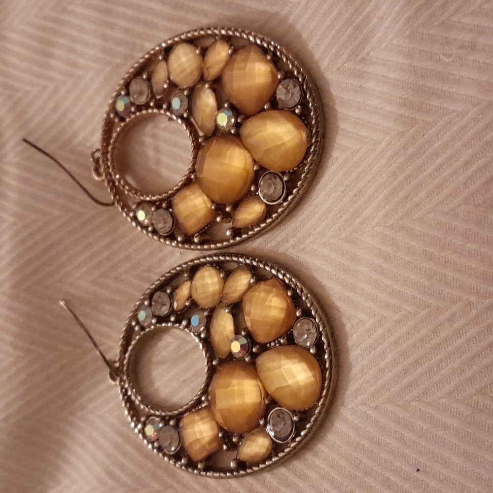 Earrings gold tone with rhinestones.